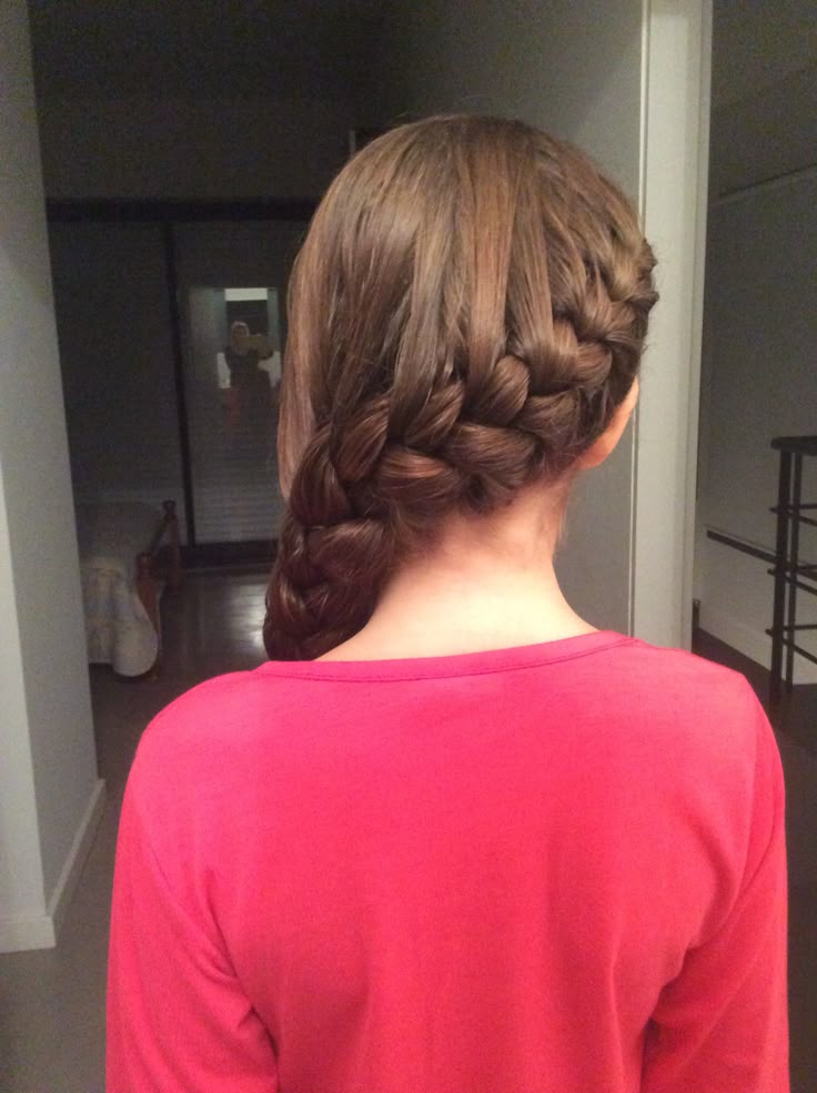 Child with a single side braid resting over one shoulder for a relaxed school look