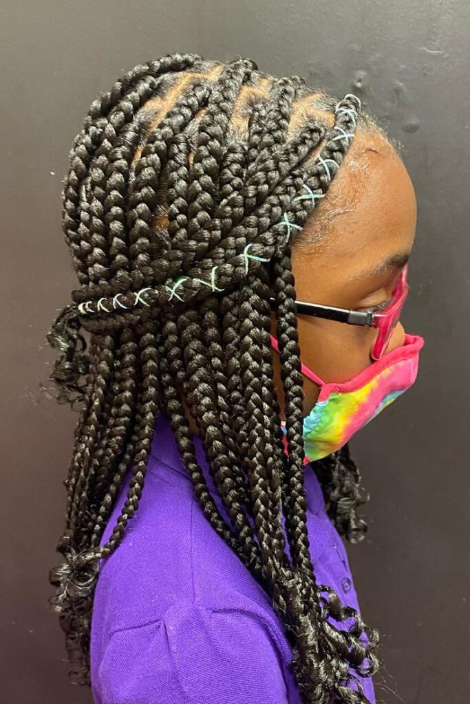 Box braids sectioned into small, uniform squares for a long-lasting protective style