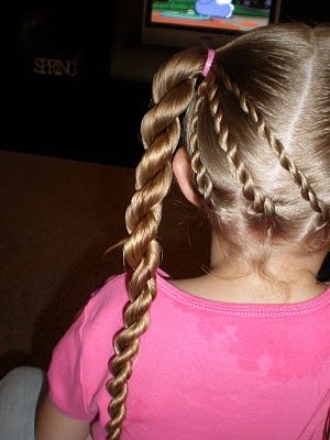 Child with neat two-strand twists from root to tip, a gentle protective style