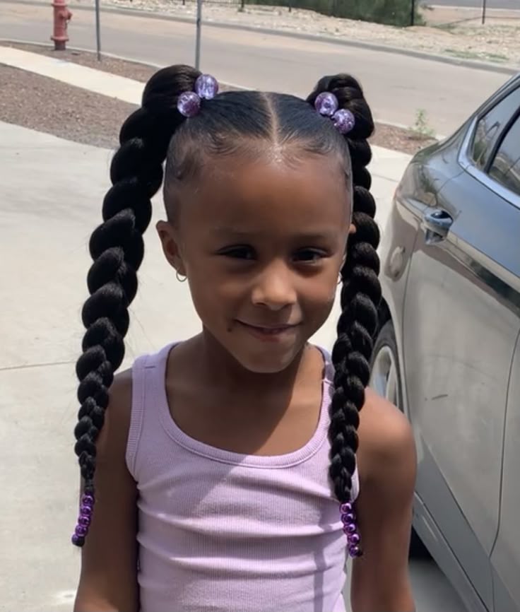 Braided pigtails on a young girl