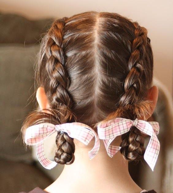 Little girl with a looped upside-down French braid styled for school