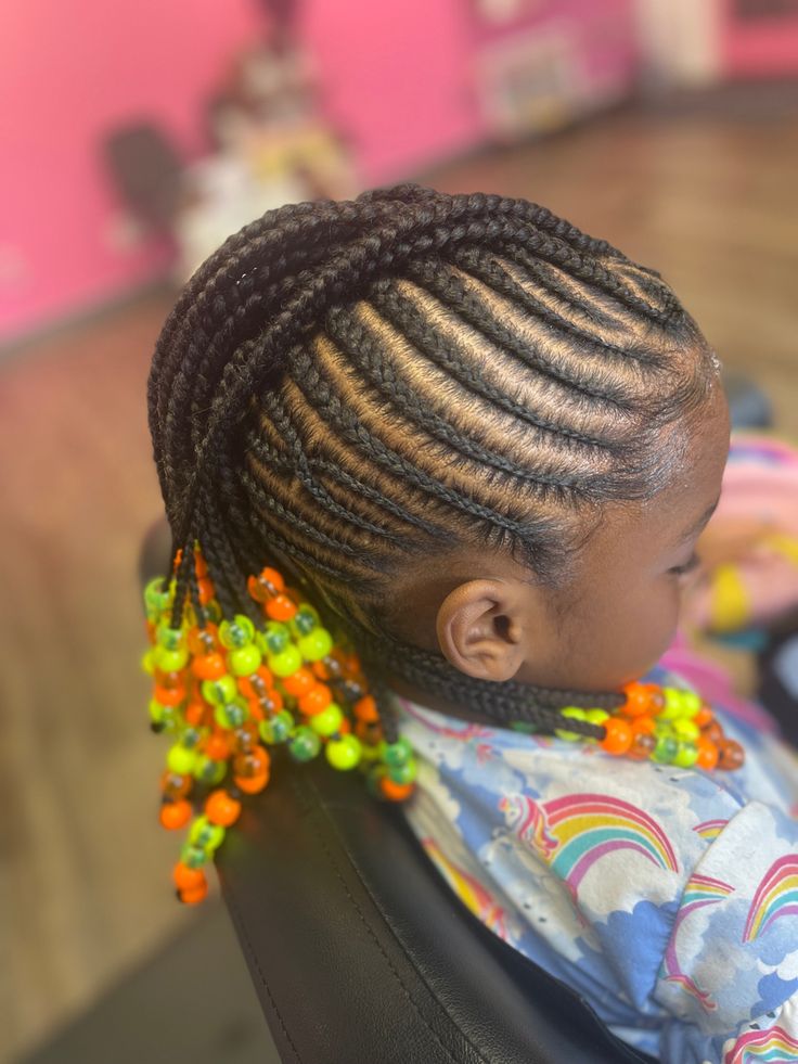 Cornrow mohawk with sides braided toward a raised center section