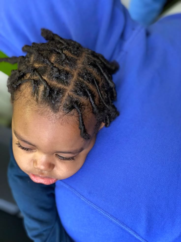 Youg toddler with neatly finished starters loc