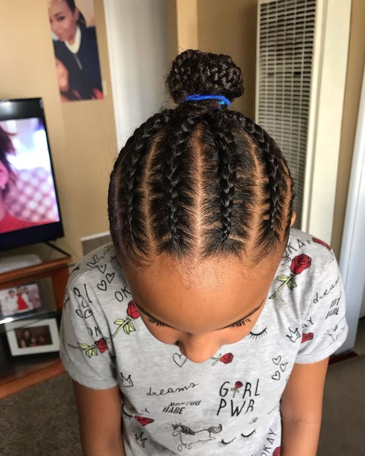 Braids gathered into a neat bun for a polished school look