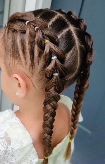 Child with a double, chunky pull-through braid styled down the back of the head