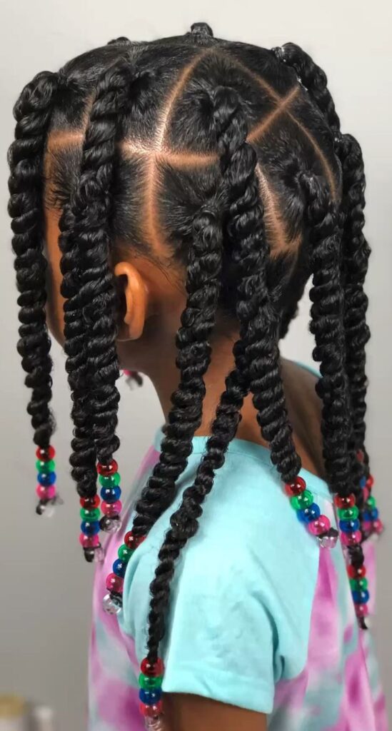 Child wearing two-strand twists with colorful beads at the ends