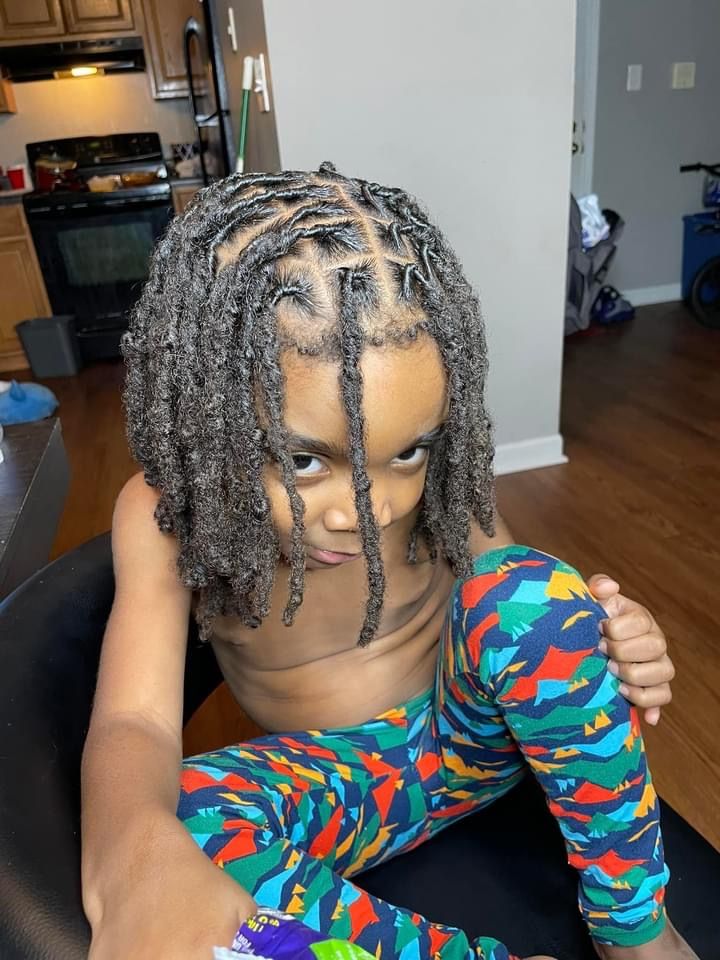 Boy with semi-freeform locs hairstyle