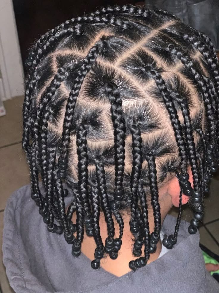 Beaded braids hairstyle for boys