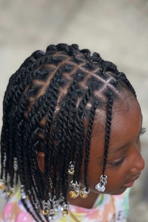 A young girl with a neatly twisted protective style without pulling the scalp