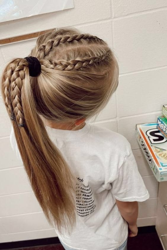 Low ponytail with two thin accent braids along the front hairline for sporty days