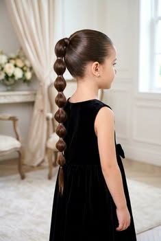 Child with a bubble ponytail styled with rounded sections