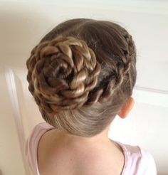 Girl with a braided spiral bun pinned at the back of her head