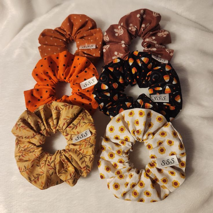 Fall-themed scrunchies with pumpkin, ghost, and candy corn prints