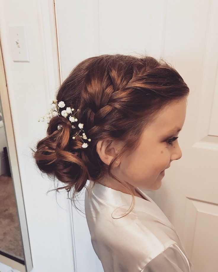 Girl with curly side bun and braided accent