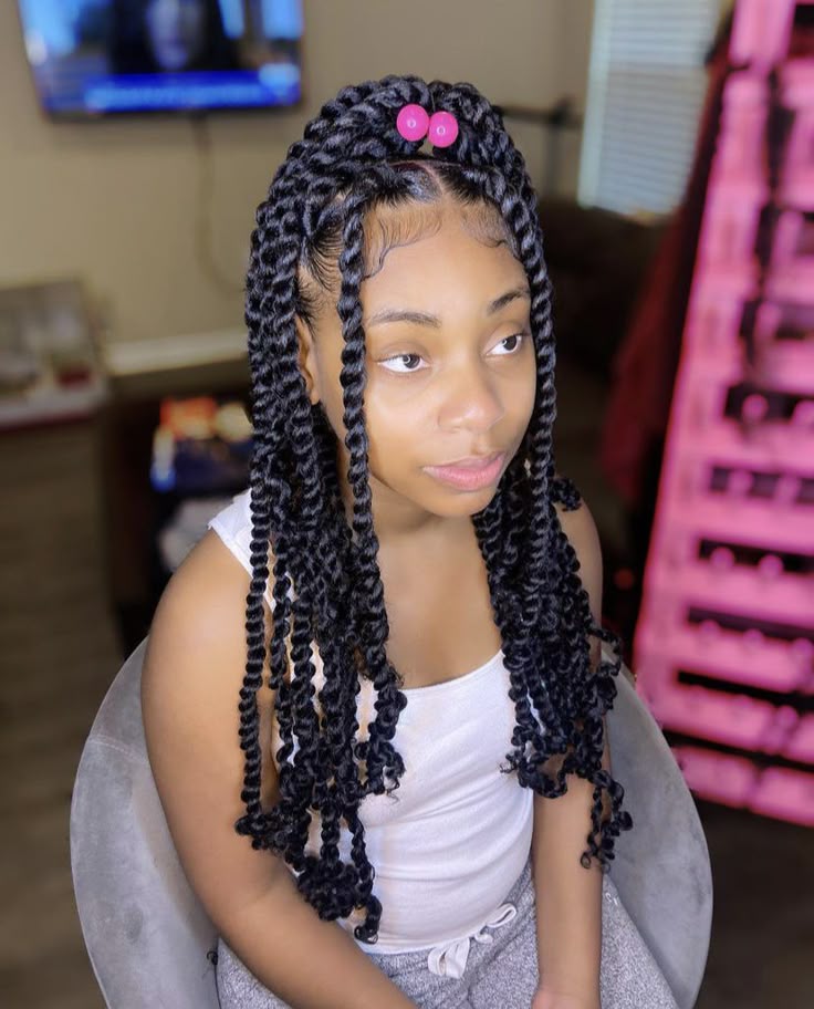 Girl with a neatly styled hairstyle with passion twist extention