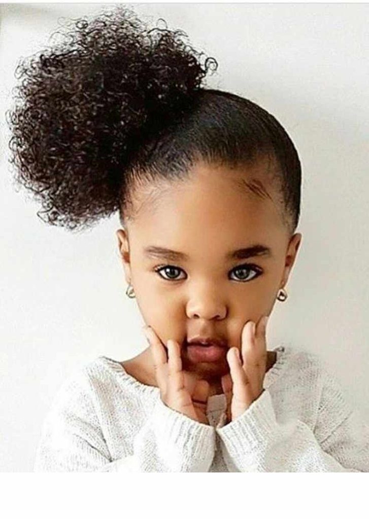 Girl with side afro puff style
