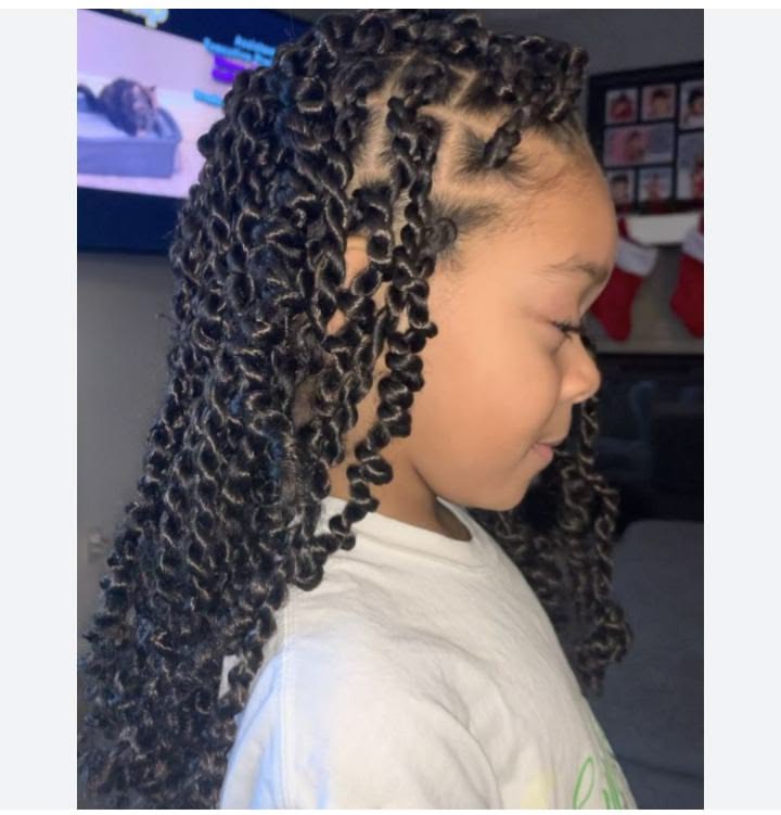 Little girl with bouncy spring twists styled halfway down her back