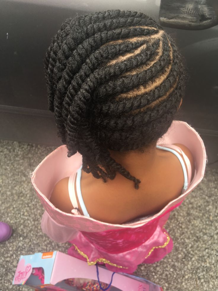 Girl with a side swept flat twist hairstyle