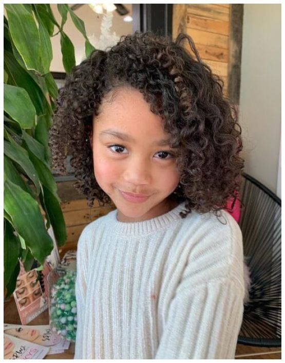 Girl with shoulder-length curly bob hairstyle