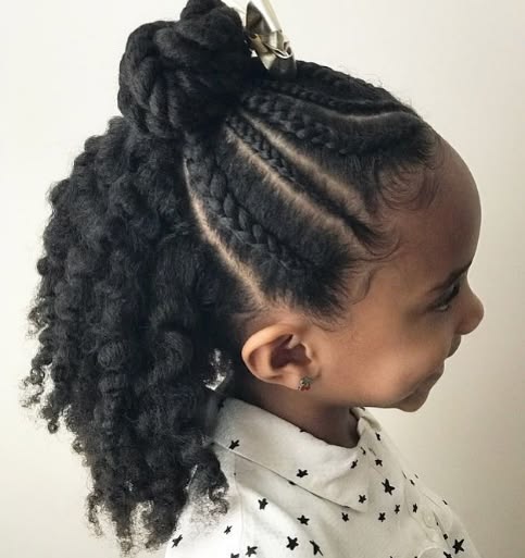 Child with braided top sections and curly natural hair left down