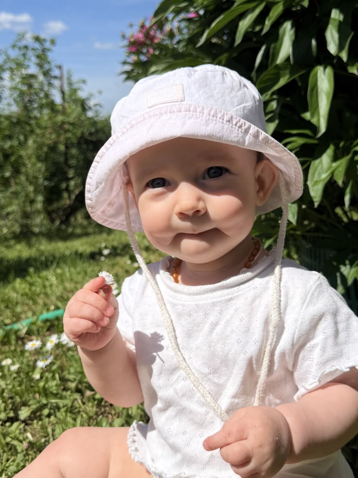 Baby wearing a sun hat outdoors