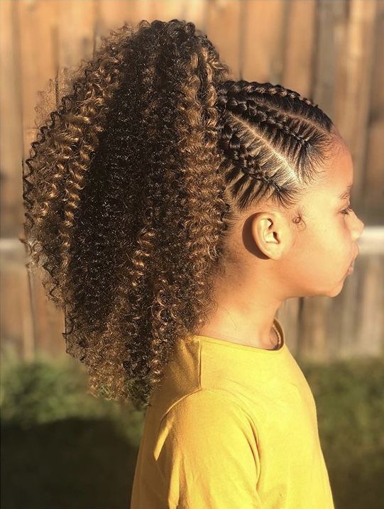 Young girl with cornrows leading into a curly ponytail, shown in profile
