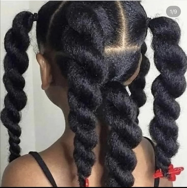 Girl with chunky twists secured with elastics